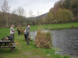 John M sportingly nets John A's Poached Trout. Sam, too far back!